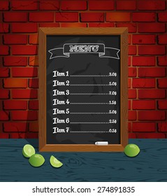 chalk board menu and limes on a brick background