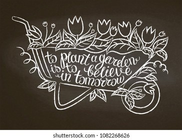 Chalk contour of vintage garden barrow with leaves and flowers and lettering - To plant a garden is to believe in tomorrow on chalk board. Typography poster with Inspirational gardening quote.