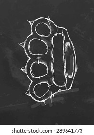 Chalk drawn spiked brass knuckles. Vector illustration.
