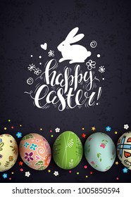 Chalk handwritten inscription Happy Easter and bunny on chalkboard. Template vector card with realistic decorated 3D eggs. Black background.