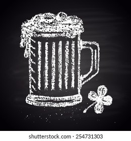Chalk painted illustration of mug with ale and clover. St. Patrick's Day theme.
