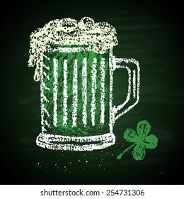 Chalk painted illustration of mug with green ale and clover. St. Patrick's Day theme.