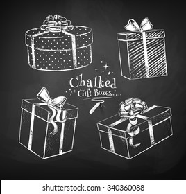 Chalk vector sketches of gift boxes on black chalkboard background.  