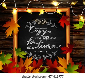 Chalkboard with autumn leaves