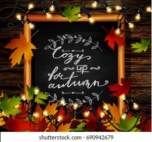 Chalkboard with autumn leaves