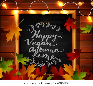Chalkboard with autumn leaves a cozy patio lights and falling leaves