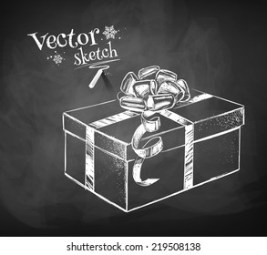 Chalkboard drawing of gift box. Vector illustration. Isolated.