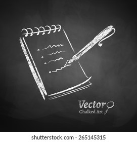 Chalkboard drawing of notepad and pen.
