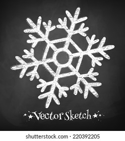 Chalkboard drawing of snowflake. Vector illustration. Isolated.