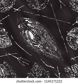 Chalkboard seamless pattern with leaves stamps. Autumn vintage background.