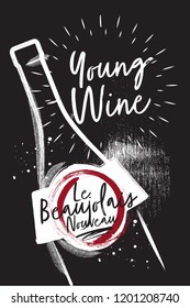 Chalked Bottle of wine close up. Etiquette and logo for the festival of young wine. Black charcoal background
