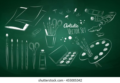 Chalked vector set of artists supplies drawn on green chalkboard background.