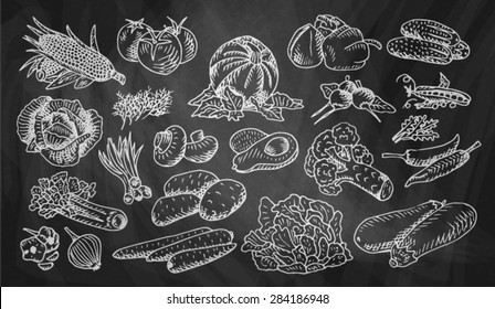 chalked vegetables on a black background