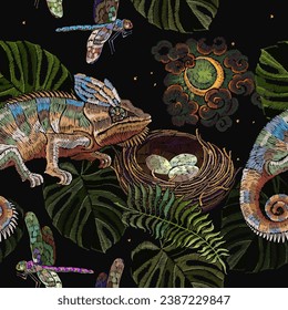 Chameleon lizard, moon, colorful dragonflies, fern and bird nest. Seamless pattern. Embroidery. Night jungle forest template for design of clothes