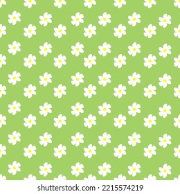 Chamomile floral seamless pattern on green background. Small summer flowers in simple cartoon doodle style perfect for textile, wallpaper, fabric.Vector illustration