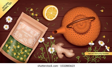 Chamomile tea package, Chinese cast iron teapot, lemon and ginger on a wooden table