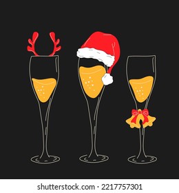 Champagne glasses with Christmas accessories. Santa hat, deer horns, bells	