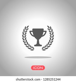 Champions cup with laurel wreath. Simple icon. Icon under spotlight. Gray background