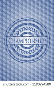 Championship blue badge with geometric pattern background.