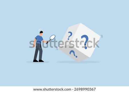 chance to win, entrepreneur using magnifying glass examines dice featuring question mark. 