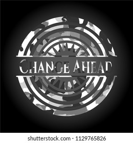 Change Ahead written on a grey camouflage texture