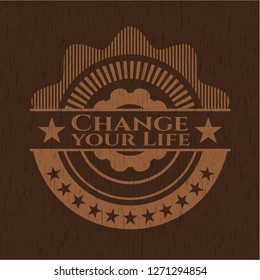 Change your Life badge with wood background