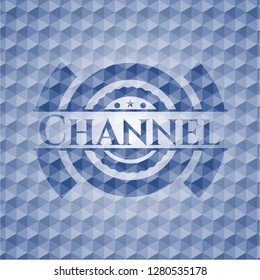 Channel blue badge with geometric pattern.