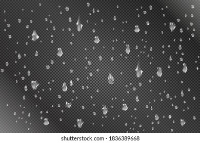 Gotas caóticas irregulares en el vaso. Las lluvias caen sobre un fondo transparente. La lluvia gotea sobre el vaso.