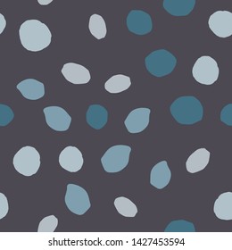 Chaotic pebble seamless pattern on black background. Abstract geometric dotted texture. Random stones wallpaper. Vector illustration