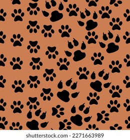 Chaotic seamless pattern with animal tracks. Black paws of a cat and a dog on a coffee background. Design for fashion, fabric, textile, wallpaper, cover. Vector pattern in EPS10.