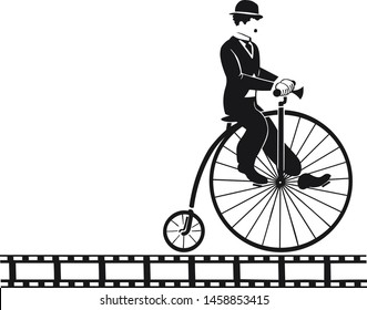 Chaplin is riding on an old bike