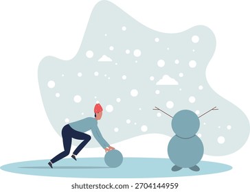 Eine Figur in einem Weihnachtsmütze macht einen Schneemann. Winterkonzept.