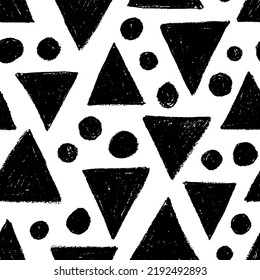 Charcoal triangles and dots seamless pattern. Hand drawn charcoal or chalk triangles with rough edges and dry texture. Abstract background with black silhouettes of geometric shapes. 