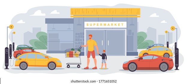 Charging point area for plug or unplug electric car at supermarket parking yard. Green energy battery supply station. Plug-in vehicle. Father son pushing shopping trolley cart filled grocery purchases