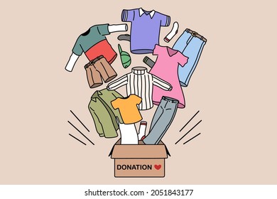 Charity and donating clothes concept. Box with donation word and carious human clothes flying from it for needing people vector illustration  - Shutterstock ID 2051843177