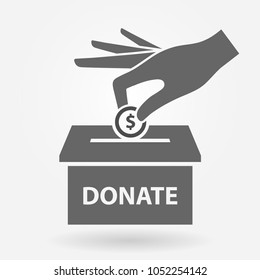 Charity icon concept. Hand putting money coin in the donation box