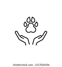 Charity and philanthropy concept. Hight quality sign drawn with thin line. Suitable for web sites, stores, internet shops, banners etc. Line icon of dogs paw over opened hands 