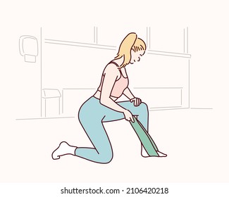 Charming blonde young slim woman in sports clothing stretching in gym. Hand drawn style vector design illustrations.