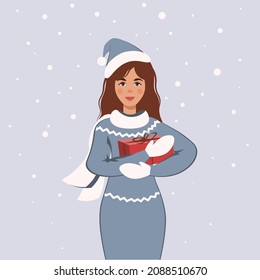 Charming girl with gift box in hands. Female character in cozy knitted sweater or dress in snowfall weather. Winter Xmas and New year season vector illustration. 
