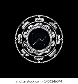 chart icon inside chalk emblem written on a blackboard