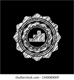 chart icon inside chalkboard emblem on black board