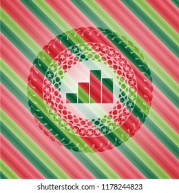 chart icon inside christmas colors emblem.