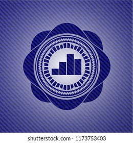 chart icon inside emblem with jean background