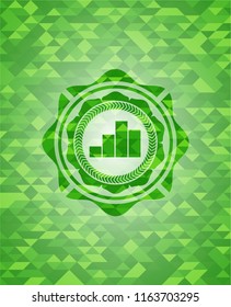 chart icon inside green emblem with triangle mosaic background