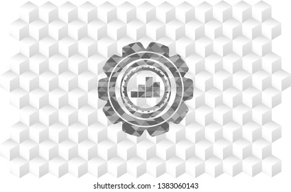 chart icon inside grey badge with geometric cube white background