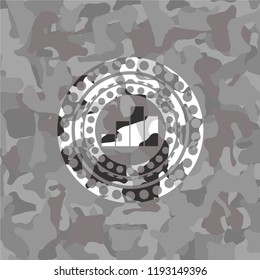 chart icon inside grey camouflage emblem