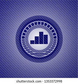 chart icon inside jean or denim emblem or badge background