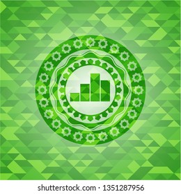 chart icon inside realistic green emblem. Mosaic background