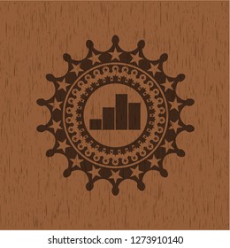 chart icon inside realistic wood emblem