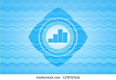 chart icon inside sky blue water wave style emblem.